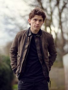 tom holland wearing brown cotton jacket on black collar
