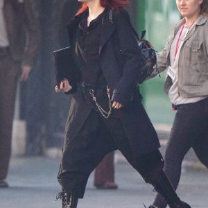 Emma Stone Wearing Black Trench Coat In Cruella Film