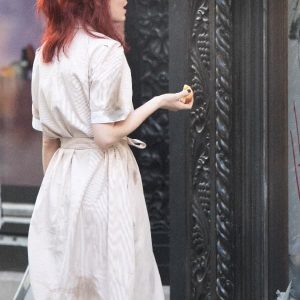 Actress Emma Stone Wearing Casual Trench Coat In Cruella Film