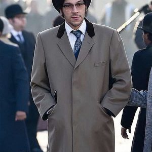 Joel Fry Wearing Gray Coat In Cruella Movie as Jasper