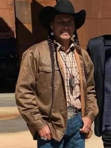 Mo Brings Plenty Wearing Brown Jacket In Yellowstone as Rainwater's Driver