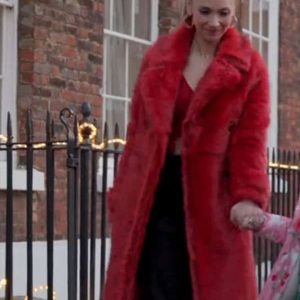 Juno Temple Wearing red fur coat In Ted Lasso as Keeley Jones