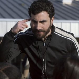 Actor Brett Goldstein Wearing Black Tracksuit Jacket In Ted Lasso as Roy Kent